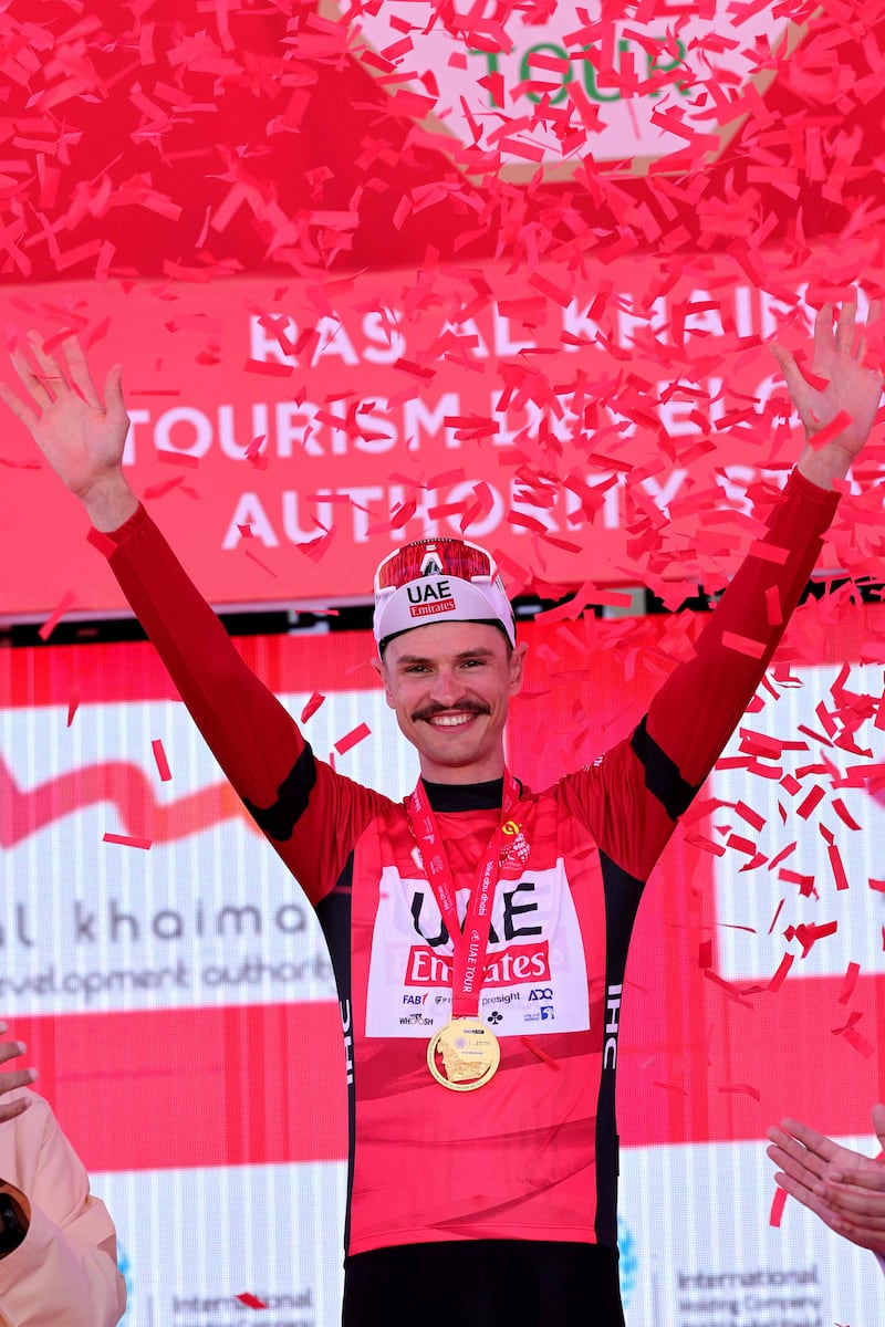 UAE Team Emirates rider Jay Vine celebrates after becoming the new race leader. AFP