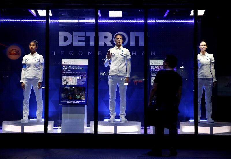 A man looks at models of android robots, game characters from "Detroit: Become Human" at Tokyo Game Show 2017 in Chiba, east of Tokyo, Japan, September 21, 2017. REUTERS/Kim Kyung-Hoon