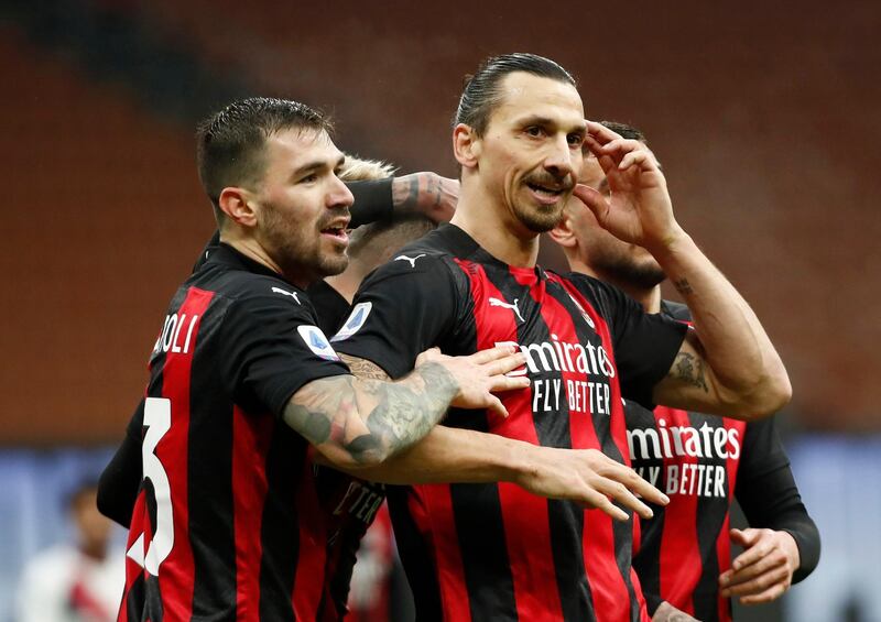 Milan's Ante Rebic celebrates scoring their third goal with Zlatan Ibrahimovic. Reuters