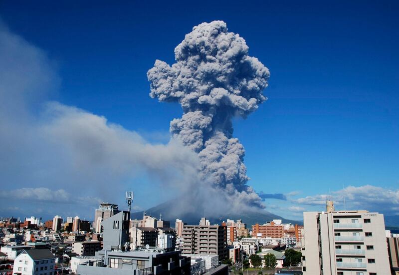 In this photo released by Kagoshima Local Meteorological Observatory, volcanic smoke billows from Mount Sakurajima in Kagoshima, on the southern Japanese main island of Kyushu Sunday, Aug. 18, 2013. Kyodo reported that it erupted Sunday evening, marking the 500th eruption this year at the 1,117 meters (3,686 foot) high mountain, which is one of Japan's most active volcanoes. There is no immediate reports of injuries.  (AP Photo/Kagoshima Local Meteorological Observatory) CREDIT MANDATORY *** Local Caption ***  Japan Eruption.JPEG-0c9ae.jpg