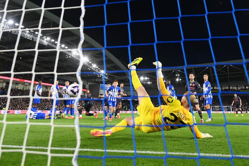Brighton goalkeeper Jason Steele fails to save a free-kick from Phil Foden of Manchester City as the visitors went 2-0 up. Getty