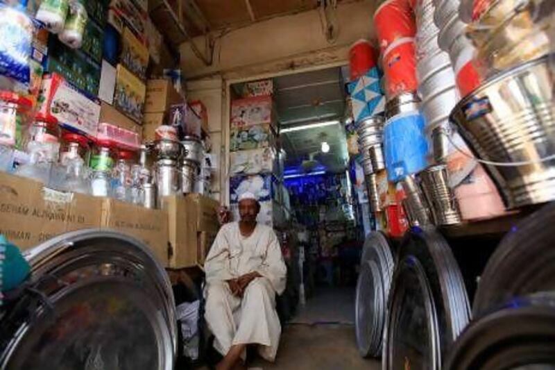 A shopkeeper waiting for customers in Khartoum. REUTERS