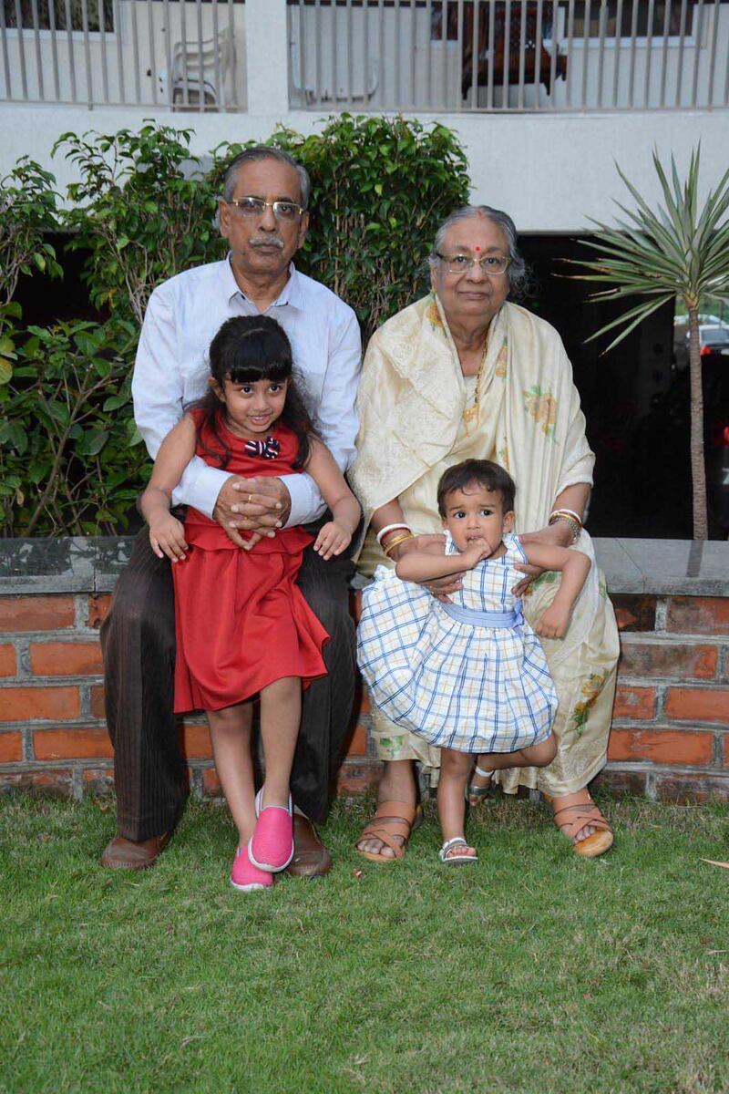 Amal Kumar Mandal and his wife Tripti with their grandchildren Anahita and Ayantika in happier times at their home in Baroda, India a year ago. The couple are among 19 Indians stranded in Dubai International Airport for more than three weeks after they missed a connecting flight to India due to bad weather. Courtesy: Amal Kumar Mandal