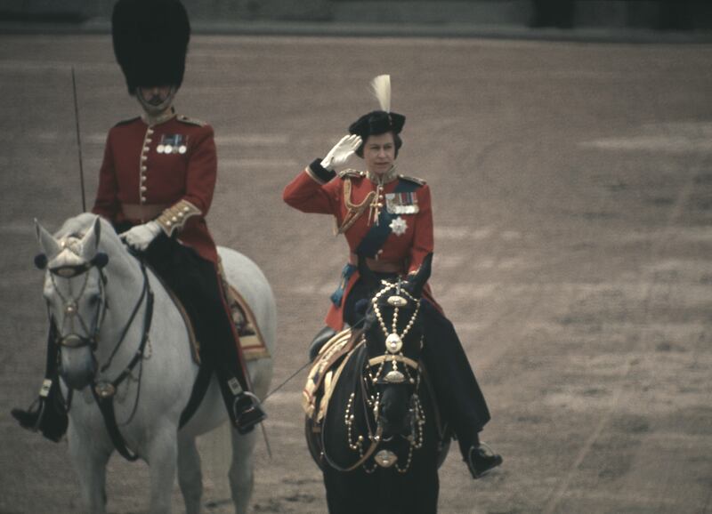 Queen Elizabeth sits astride her horse Burmese as she makes her way from Buckingham Palace along The Mall in 1971