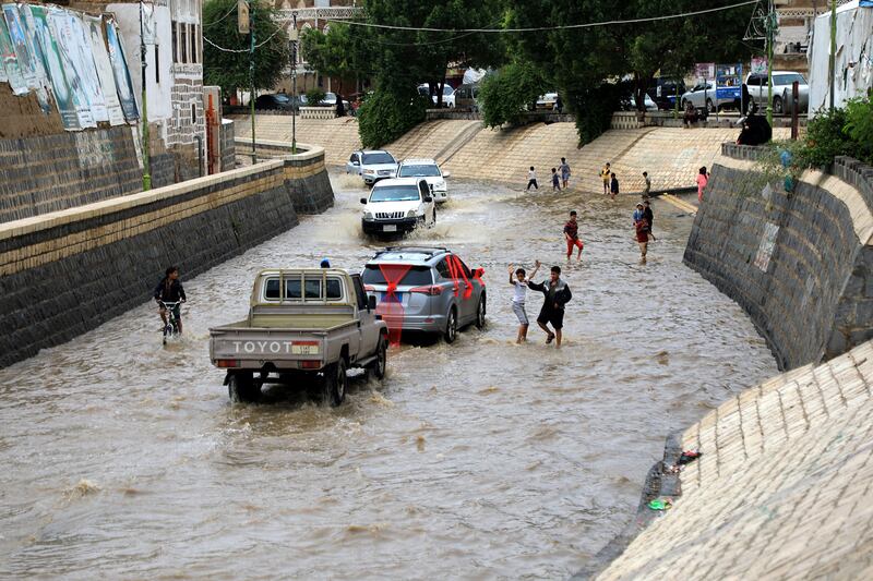 It's wading rather than walking for most of Sanaa's pedestrians. AFP