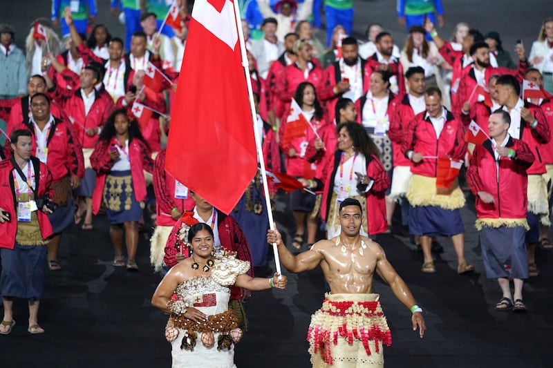 Team Tonga enter the Alexander Stadium during the opening ceremony of the Commonwealth Games, in Birmingham, England, Thursday July 28, 2022.  Jacob King / PA via AP)