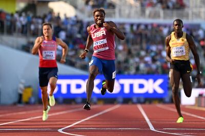 Noah Lyles crosses the finish line ahead of Jan Jirka and Owen Ansah to win his 200m heat at the World Athletics Championships. AFP