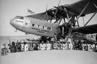 The Imperial Airways Hannibal Class Handley Page HP42 passenger plane Hanno, surrounded by an armed guard provided by the Sheikkh of Sharjah during a refuelling stop at Kuwait.   (Photo by Fox Photos/Getty Images)