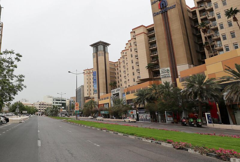 DUBAI, UNITED ARAB EMIRATES , April 11 – 2020 :- Almost empty road near the Al Ghurair Centre in Deira Dubai. Dubai is conducting 24 hours sterilisation programme across all areas and communities in the Emirate and told residents to stay at home. UAE government told residents to wear face mask and gloves all the times outside the home whether they are showing symptoms of Covid-19 or not. (Pawan Singh/The National) For News/Online/Instagram/Standalone