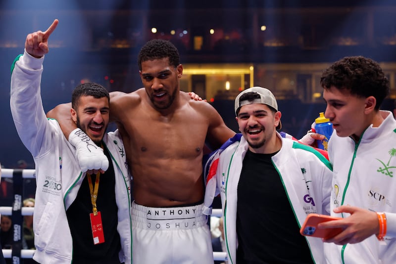 Anthony Joshua celebrates in the ring after winning his fight against Francis Ngannou. Reuters
