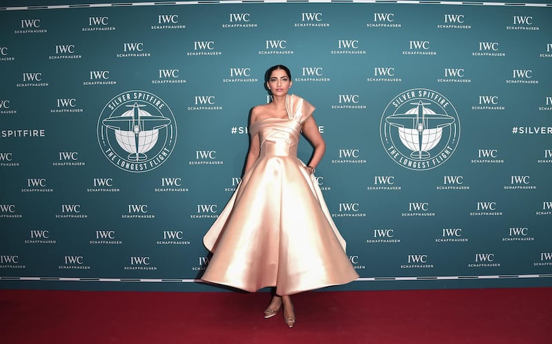 Bollywood style star Sonam Kapoor-Ahuja wears a tea-length champagne gown by Filipino designer Mark Bumgarner. Photos: Getty