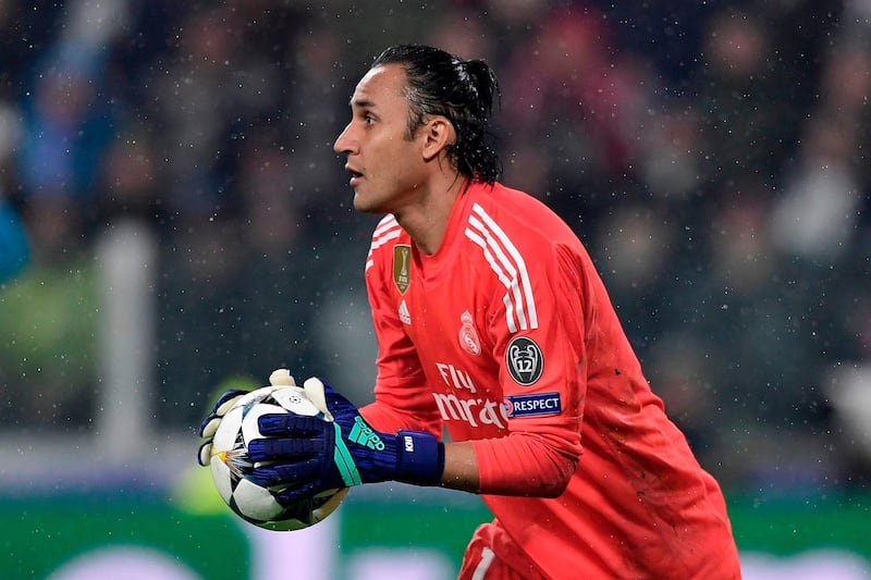 Real Madrid's Costa Rican goalkeeper Keylor Navas stops the ball during the UEFA Champions League quarter-final first leg football match between Juventus and Real Madrid at the Allianz Stadium in Turin on April 3, 2018. / AFP PHOTO / JAVIER SORIANO