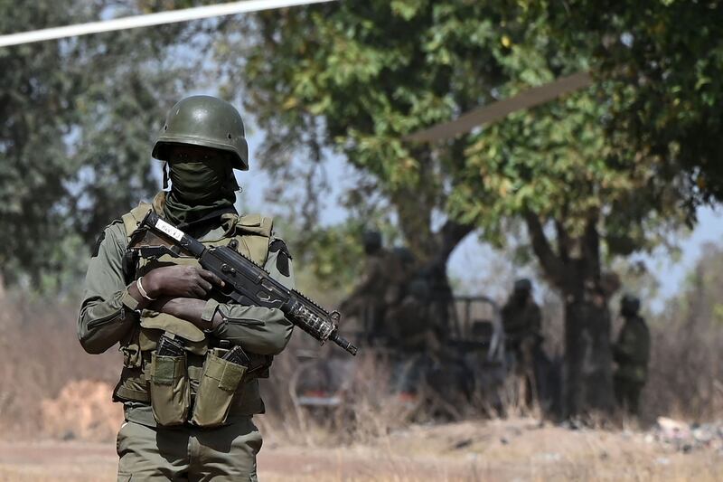 A soldier provides security for the visit of Ivorian Prime Minister Patrick Achi to the region bordering Mali and Burkina Faso, where extremist groups are a threat. AFP