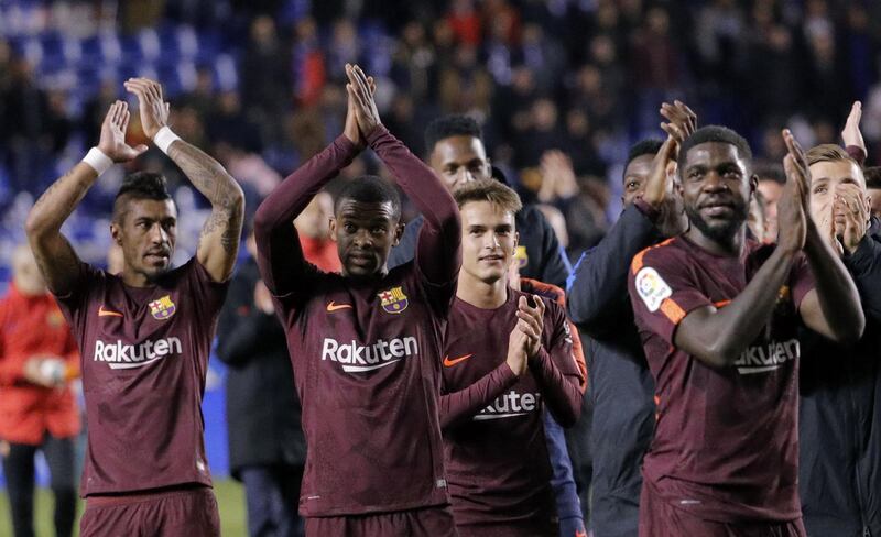 Barcelona players celebrate after winning against Deportivo de la Coruna, a result hat saw their opponents relegated from La Liga.  EPA/Lavandeira Jr