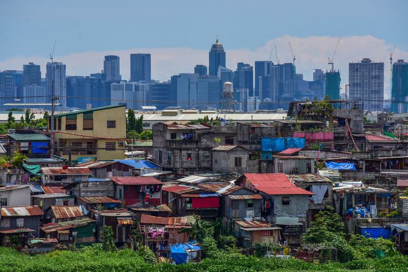 Residential and commercial buildings in Manila. Philippines President-elect Ferdinand Marcos Jr Ros has chosen a new cabinet to try to revive the economy. AFP