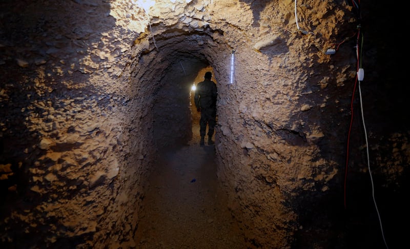 A Hizbollah member walks in the big cave of Al-Nusra terrorist groups in a mountainous area in Juroud of Arsal at the Lebanese -Syrian border. Nabil Mounzer.