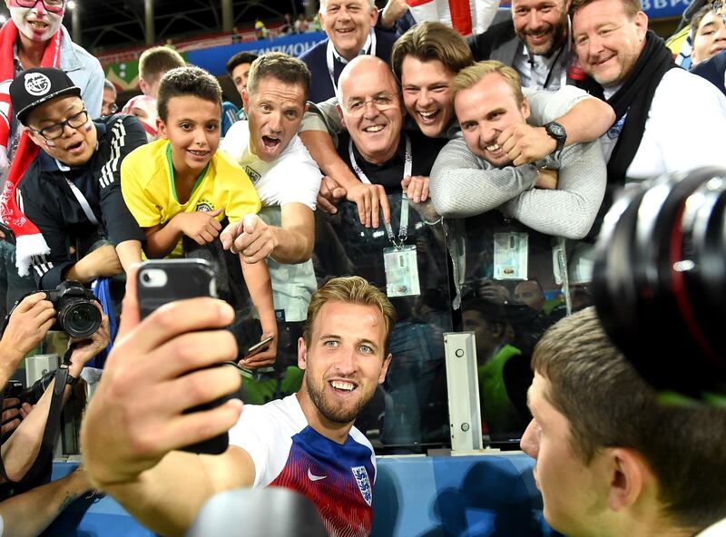 England's Harry Kane takes a selfie with fans after the win. England will now face Sweden in the World Cup quarter final. Facundo Arrizabalaga / EPA