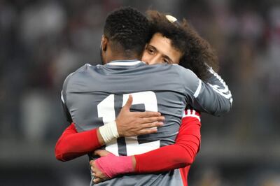 UAE's Omar Abdulrahman (back) celebrates with his teammate Khaled Eisa after scoring a penalty during the 2017 Gulf Cup of Nations semi-final football match between Iraq and the UAE at the Sheikh Jaber al-Ahmad Stadium in Kuwait City on January 2, 2018.  / AFP PHOTO / GIUSEPPE CACACE