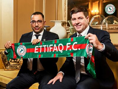 New Al Ettifaq coach Steven Gerrard poses for a photograph with club president Khaled Al Dabal. Ettifaq Media Office via Reuters