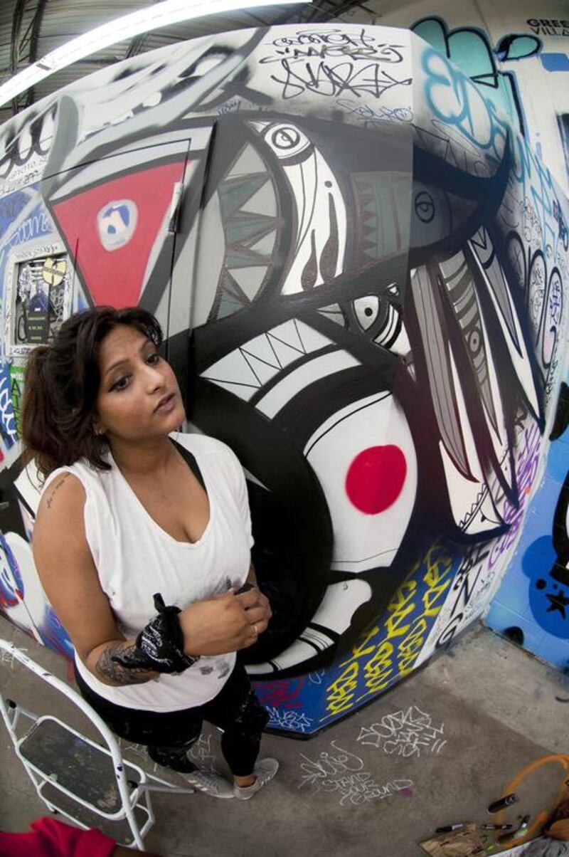 Fathima Mohiuddin with her New York mural. Courtesy Ernie Paniccioli
