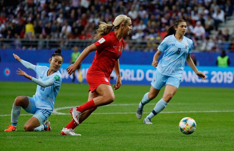 United States' midfielder Lindsey Horan, centre, runs with the ball. AFP