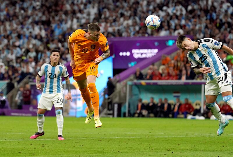 Netherlands' Wout Weghorst scores his side's first goal against Argentina. PA