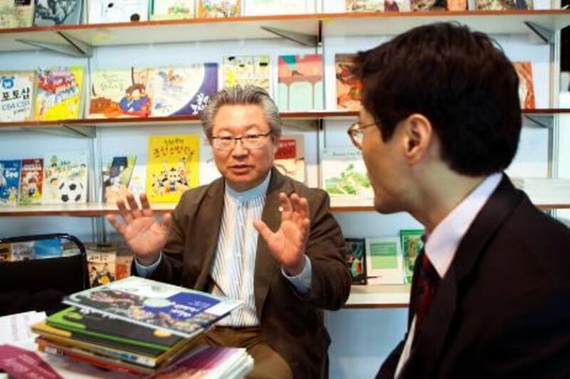 ABU DHABI, UNITED ARAB EMIRATES ‚Äì March 15, 2011: Kim Dong Hwi, CEO of Yeowon Media, and Seung Hyun Moon, director of Korean Publishers Association, left to right, are interviewed at the Abu Dhabi International Book Fair about translating Korean children's books translated to Arabic.  Last year, 130 Korean children's books were translated to Arabic.   ( Andrew Henderson / The National )
