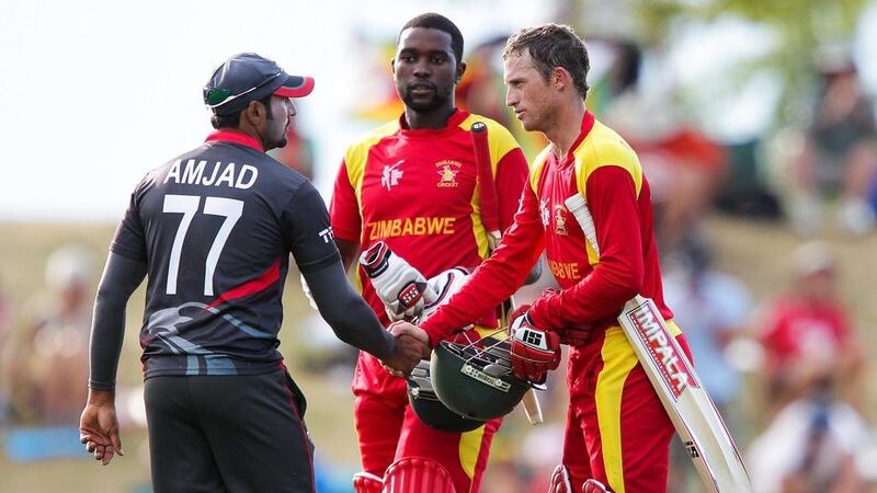 Amjad Ali, left, shakes hands with Zimbabwe batsman Sean Williams at the end of their 2015 Cricket World Cup match in Nelson, New Zealand. Zimbabwe won by four wickets. Hagen Hopkins / Getty Images