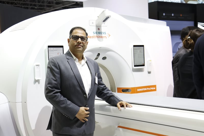 Vivek Kanade, Managing Director of Siemens Healthineers for the Middle East and Africa with the latest MRI scanner at Arab Health 2024 in Dubai. Photo: Siemens