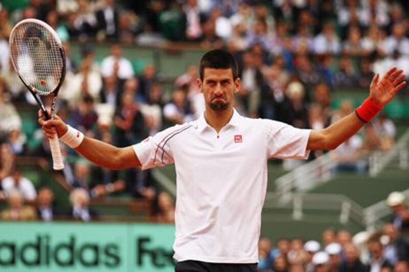 PARIS, FRANCE - JUNE 05:  Novak Djokovic of Serbia acknowledges the crowd in his men's singles quarter final match against Jo-Wilfried Tsonga of France during day 10 of the French Open at Roland Garros on June 5, 2012 in Paris, France.  (Photo by Matthew Stockman/Getty Images)