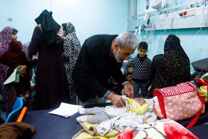 Dr Said Abdulrahman Marouf, who was detained by Israel for 45 days, examines patients at Abu Yousef Al Najjar Hospital in Rafah a day after he was released. Reuters