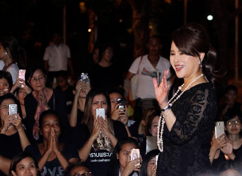 Thai Princess Ubolratana Mahidol waves to Thai people outside Grand Palace in Bangkok , Thailand. AP