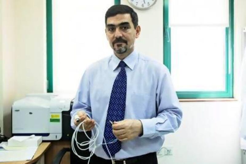 Dr Maher Mansour, consultant neurosurgeon at Sheikh Khalifa Medical City, is using cutting edge technologies to help patients deal with Parkinson's disease. The treatments do not offer a cure but can dramatically improve the lives of patients. (Lee Hoagland/The National)