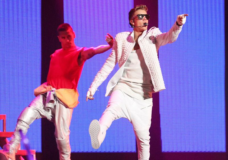 FILE PHOTO - Canadian pop singer Justin Bieber (R) performs during his world tour concert in Beijing, China September 29, 2013. REUTERS/Stringer/File Photo ATTENTION EDITORS - THIS IMAGE WAS PROVIDED BY A THIRD PARTY. CHINA OUT. NO COMMERCIAL OR EDITORIAL SALES IN CHINA.