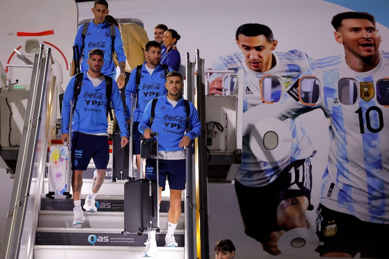 Argentina forward Lionel Messi, second right, and teammates arrive at the Hamad International Airport in Doha on November 17, 2022, ahead of the Qatar 2022 World Cup. AFP