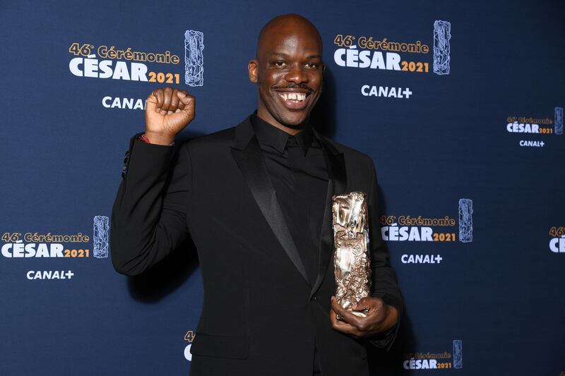 Actor Jean-Pascal Zadi poses during a photocall after receiving the Best Male Newcomer Award for his role in the film "Tout simplement noir" ( (Simply Black) during the 46th Cesar Awards ceremony at the Olympia concert hall  in Paris, France, March 12, 2021. Pascal Le Segretain/Pool via REUTERS