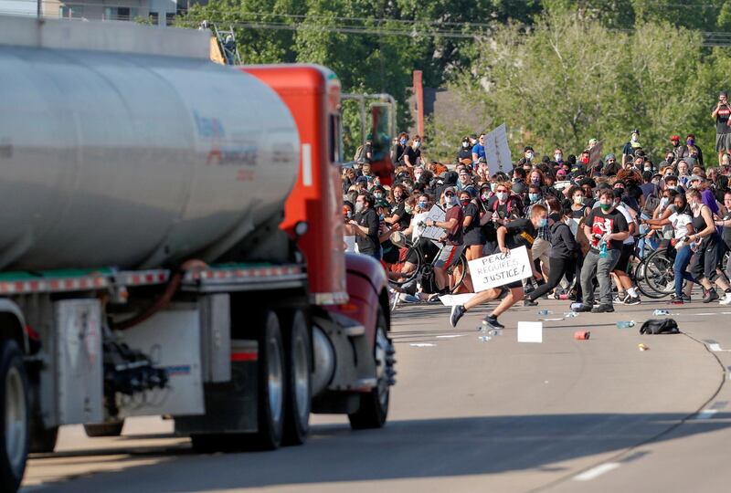 A tanker truck drives into thousands of protesters marching on 35W north bound highway during a protest against the death in Minneapolis police custody of George Floyd, in Minneapolis, Minnesota, U.S. May 31, 2020. REUTERS/Eric Miller     TPX IMAGES OF THE DAY