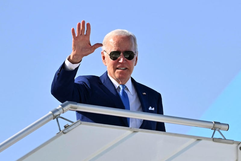 US President Joe Biden waves from a plane at King Abdulaziz International Airport in Jeddah. AFP