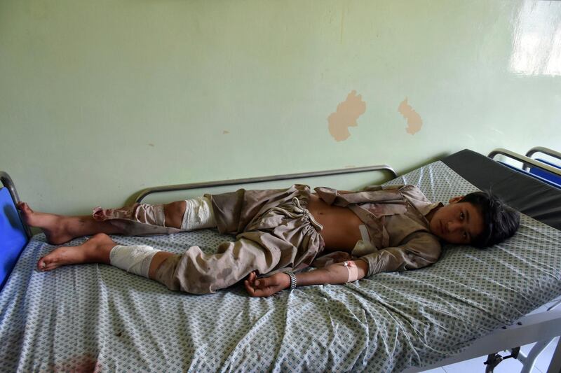 A wounded boy receives treatment at a hospital after a car bomb blast on an intelligence compound in Aybak, the capital of the Samangan province in northern Afghanistan, Monday, July 13, 2020. Taliban insurgents launched a complex attack on the compound that began with a suicide bombing, officials said. (AP Photo)