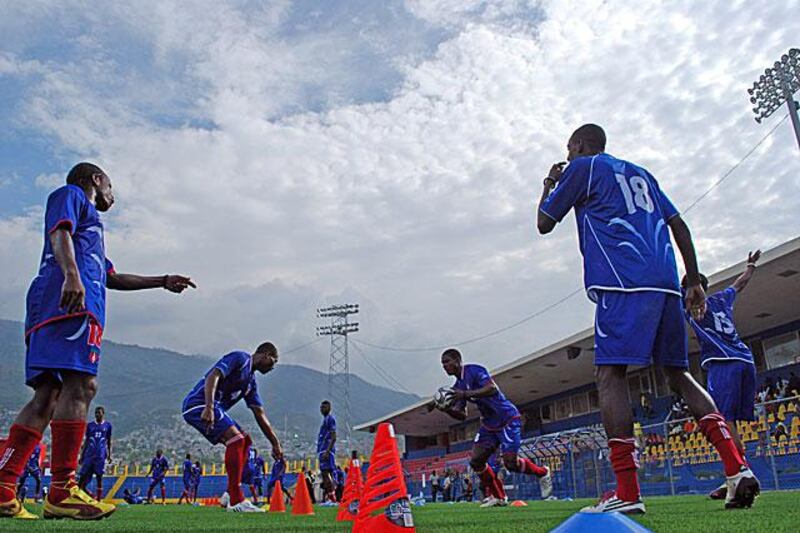 Haiti footballers warm up ahead of their World Cup qualifier against the US Virgin Islands at the Sylvio Cator stadium in Port-au-Prince. Their first home match since last year's 7.0 magnitude earthquake.

All photos by James Montague