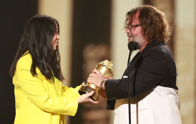 Awkwafina presents actor Jack Black with the Comedic Genius Award. AFP