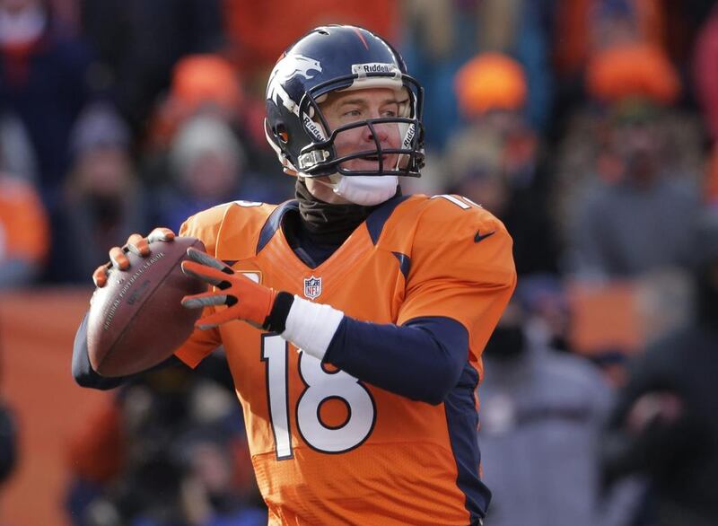 Denver Broncos quarterback Peyton Manning is not ready to let his record-setting season end without the final stop being the Super Bowl. Tom Brady and the New England Patriots stand in his way. Charlie Riedel / AP Photo

 
