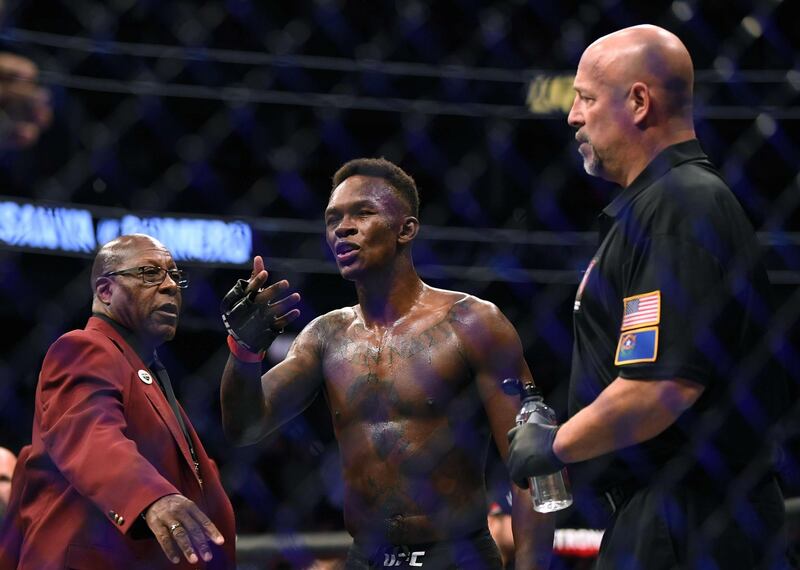 Israel Adesanya argues with Yoel Romero's corner after his decision win at UFC 248. AFP