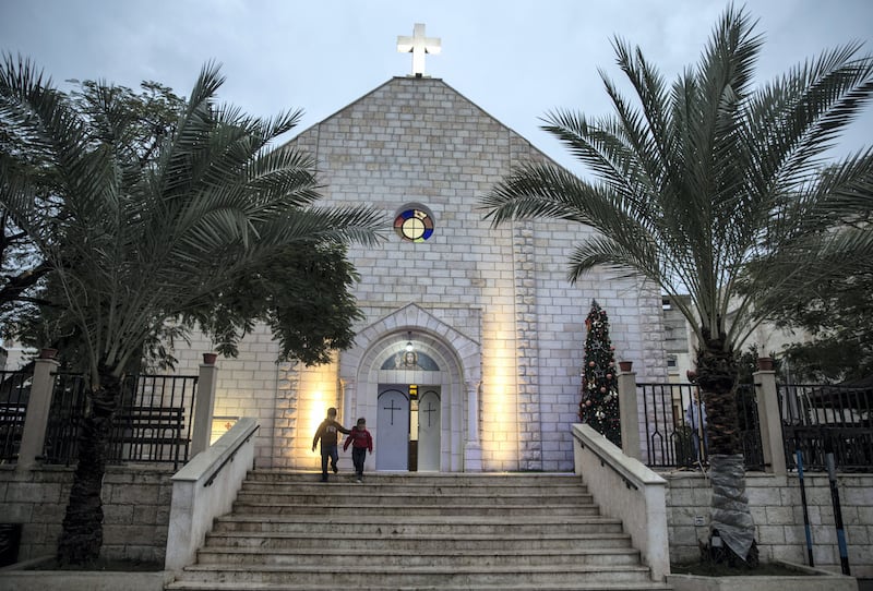 Found children are seen leaving The Holy Family Church in Gaza City on December 20,2018.Christmas time compounds a years worth of hopes and fears. Father Yousef Assad, 44, who works in Gaza CityÕs Roman Catholic Church, said he was simply praying that next year wouldnÕt get worse. He looks to the past Ñ when Churches once thrived across Gaza, and the coastal enclave was at the center of trade between Africa and Asia Ñ for inspiration (Photo by Heidi Levine for The National).