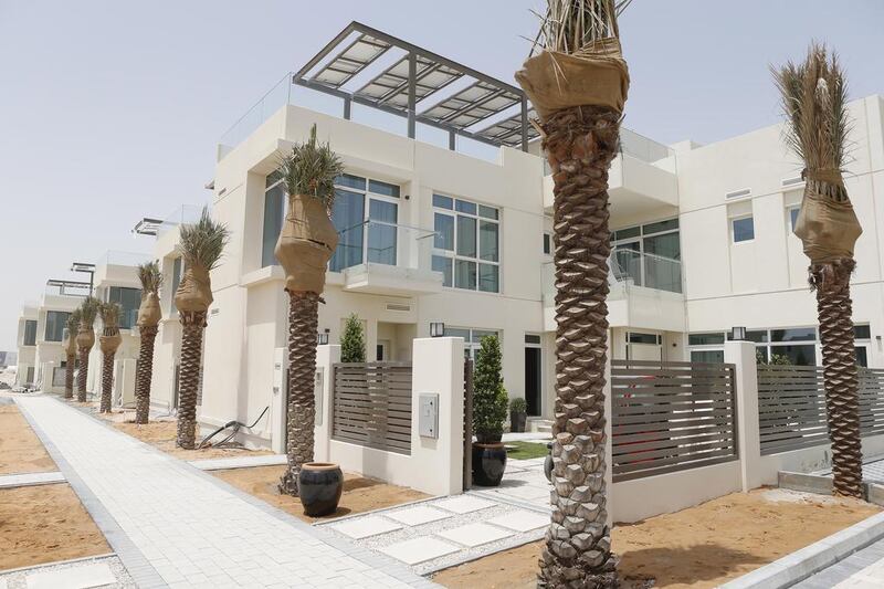 Core Savills says that tenants in suburban areas such as Dubailand could see rents drop by between 2 and 4 per cent next year. Above, new villas at Sustainable City in Dubailand. Antonie Robertson / The National