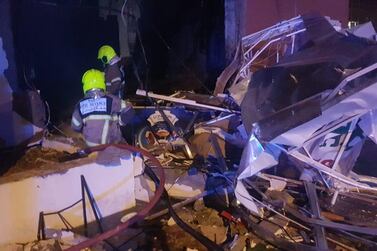 Firefighters at the scene of a gas cylinder explosion that tore through a restaurant in International City, Dubai. Dubai Civil Defence