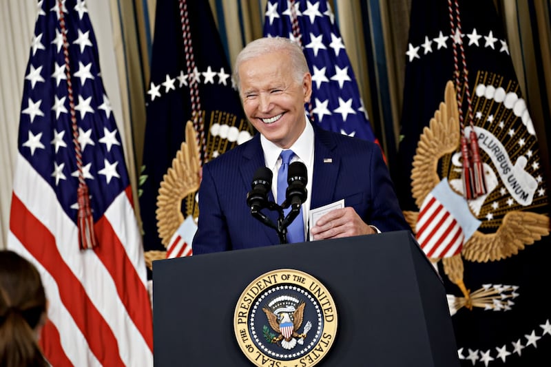 Mr Biden was all smiles during a news conference in the White House. Bloomberg