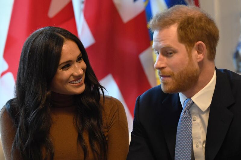 LONDON, UNITED KINGDOM - JANUARY 07: Prince Harry, Duke of Sussex and Meghan, Duchess of Sussex gesture during their visit to Canada House in thanks for the warm Canadian hospitality and support they received during their recent stay in Canada, on January 7, 2020 in London, England. (Photo by DANIEL LEAL-OLIVAS  - WPA Pool/Getty Images)