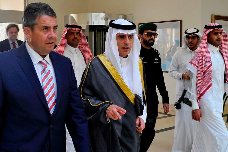 Saudi Arabia's foreign minister Adel Al Jubeir, centre, walking with his German counterpart Sigmar Gabriel in the Red Sea resort of Jeddah on July 3, 2017. The two leaders met to discuss the ongoing crisis in the Gulf where Saudi Arabia, the UAE, Bahrain and Egypt have cut ties with Qatar over its support for terrorism. AFP Photo