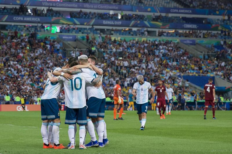 Argentina players celebrate with Giovani Lo Celso after he scored their second goal. Getty Images